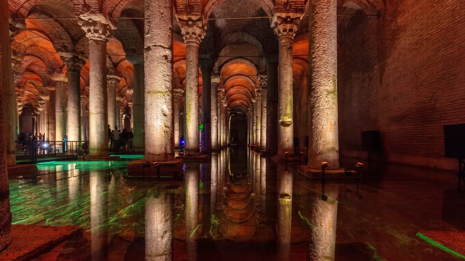 Illuminated Basilica Cistern columns reflected in the water