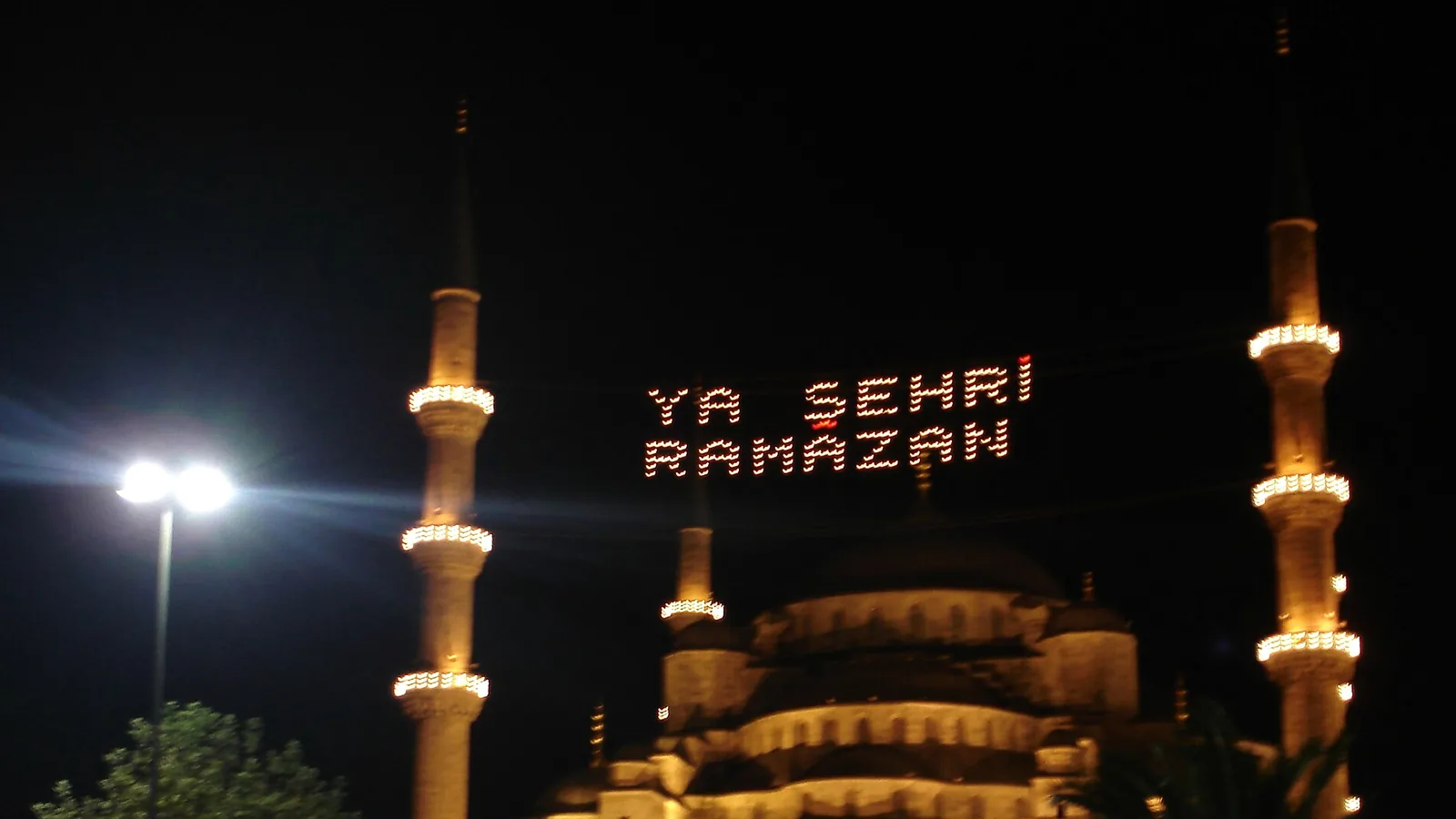 Historic 2006 documentary photograph of the Blue Mosque with “YA ŞEHRİ RAMAZAN” mahya lights